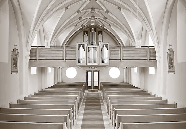 pews inside of a chapel sanctuary