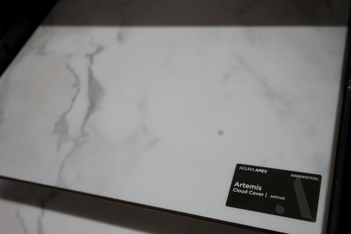 a piece of white marble tile