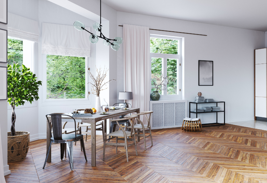 a table in a dining room with a patterned wooden floor