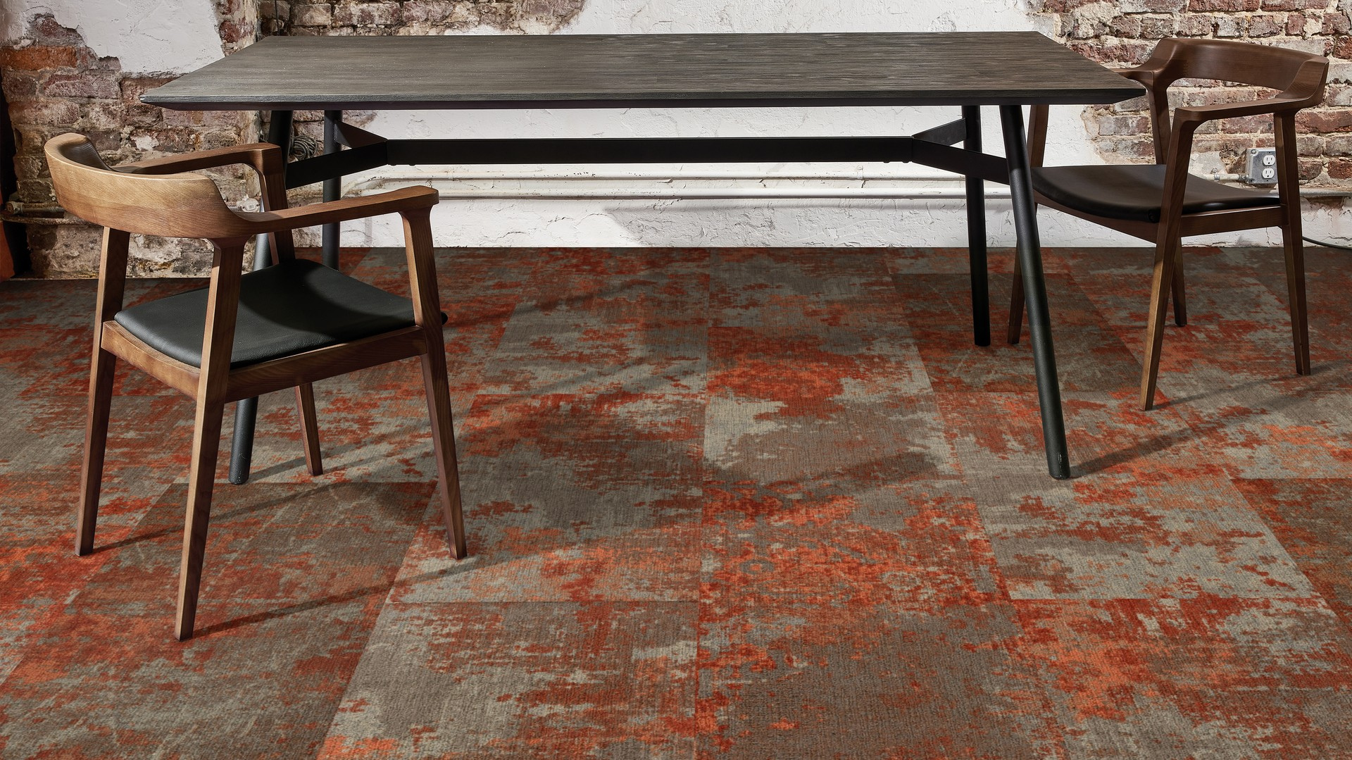 red and gray carpet with table and chairs